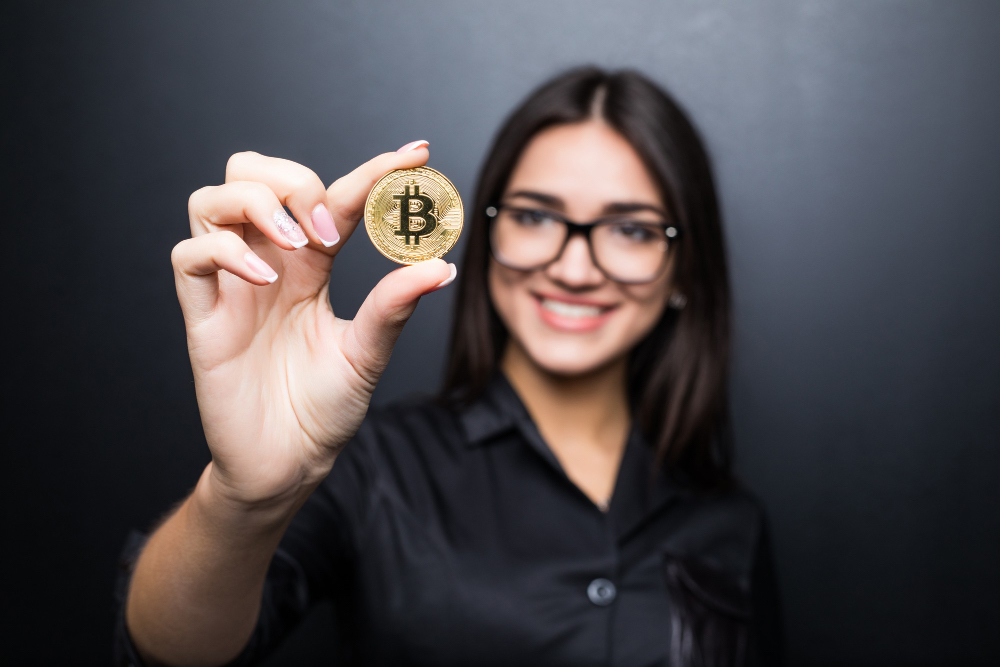 Women holding cryptocurrency bitcoin